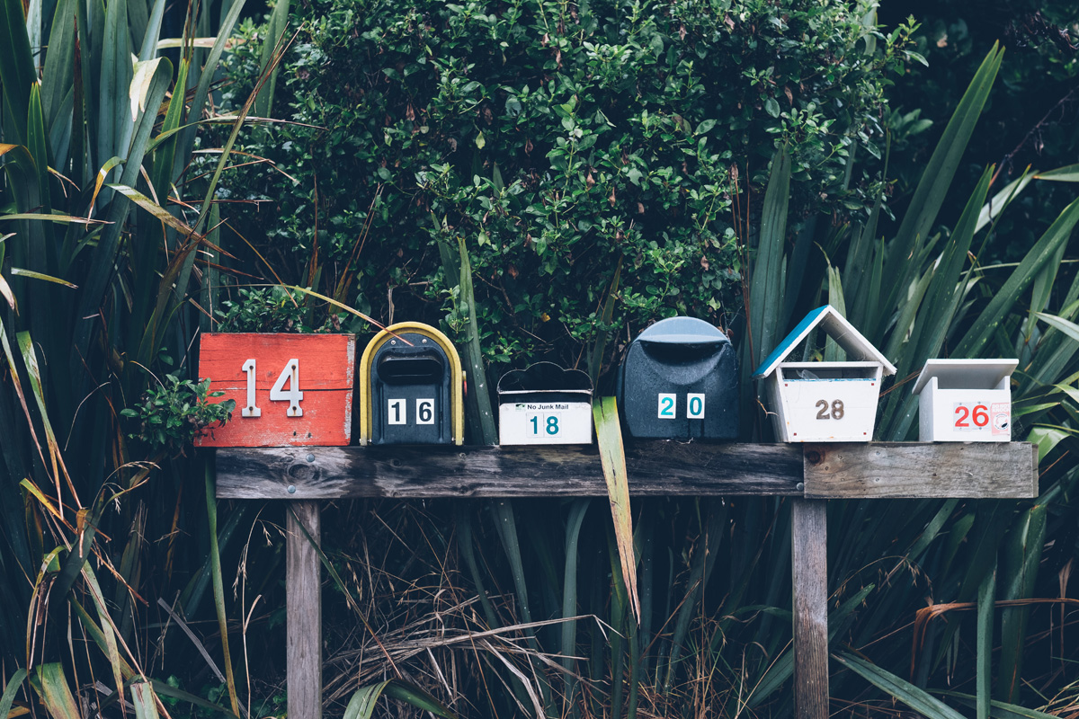 Photo with colorful mailboxes by Mathyas Kurmann on Unsplash